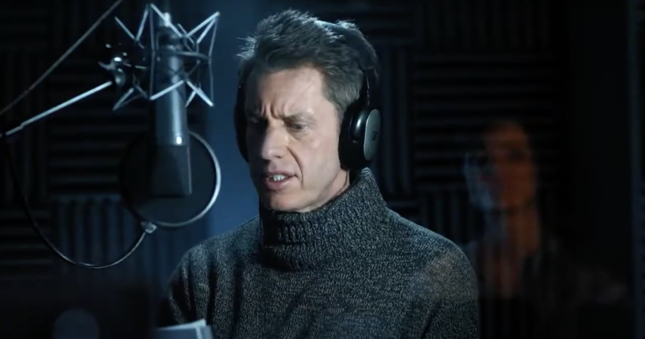 Image from TV ad of the ad hero character recording his voiceover.
