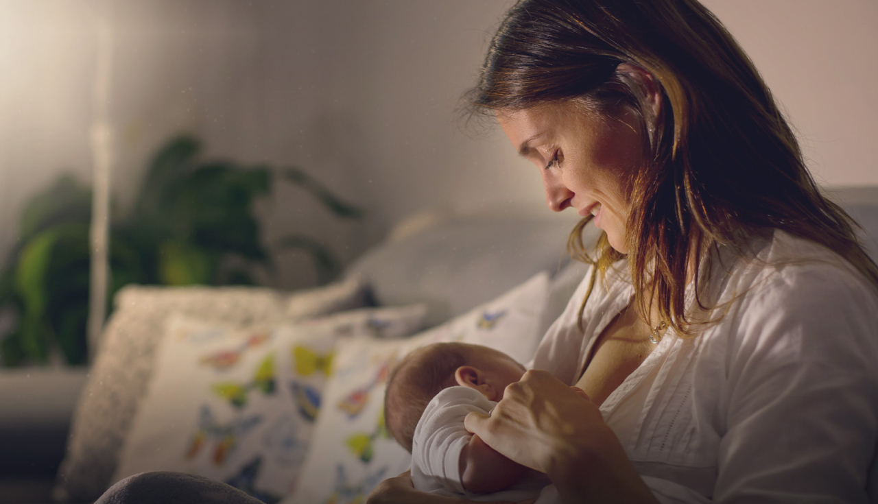 Image of mum feeding her baby.