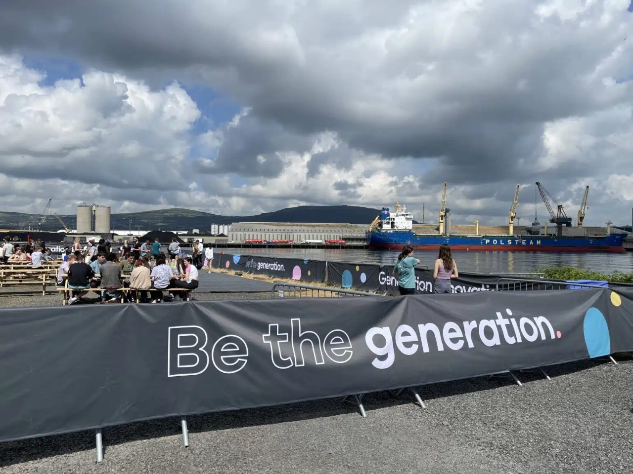 People eating outside by the river.