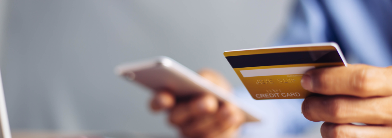 Online shopping with credit card and smartphone.