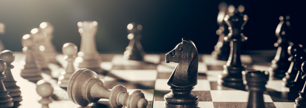 Chess pieces strategically placed on a chess board, ready for a game of intellect and strategy.